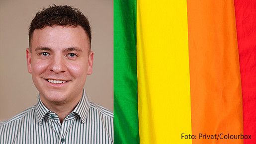 Das Foto zeigt Alexander Seeger, Mitglied der AG Diversity der dbb jugend, neben einer Regenbogenflagge.